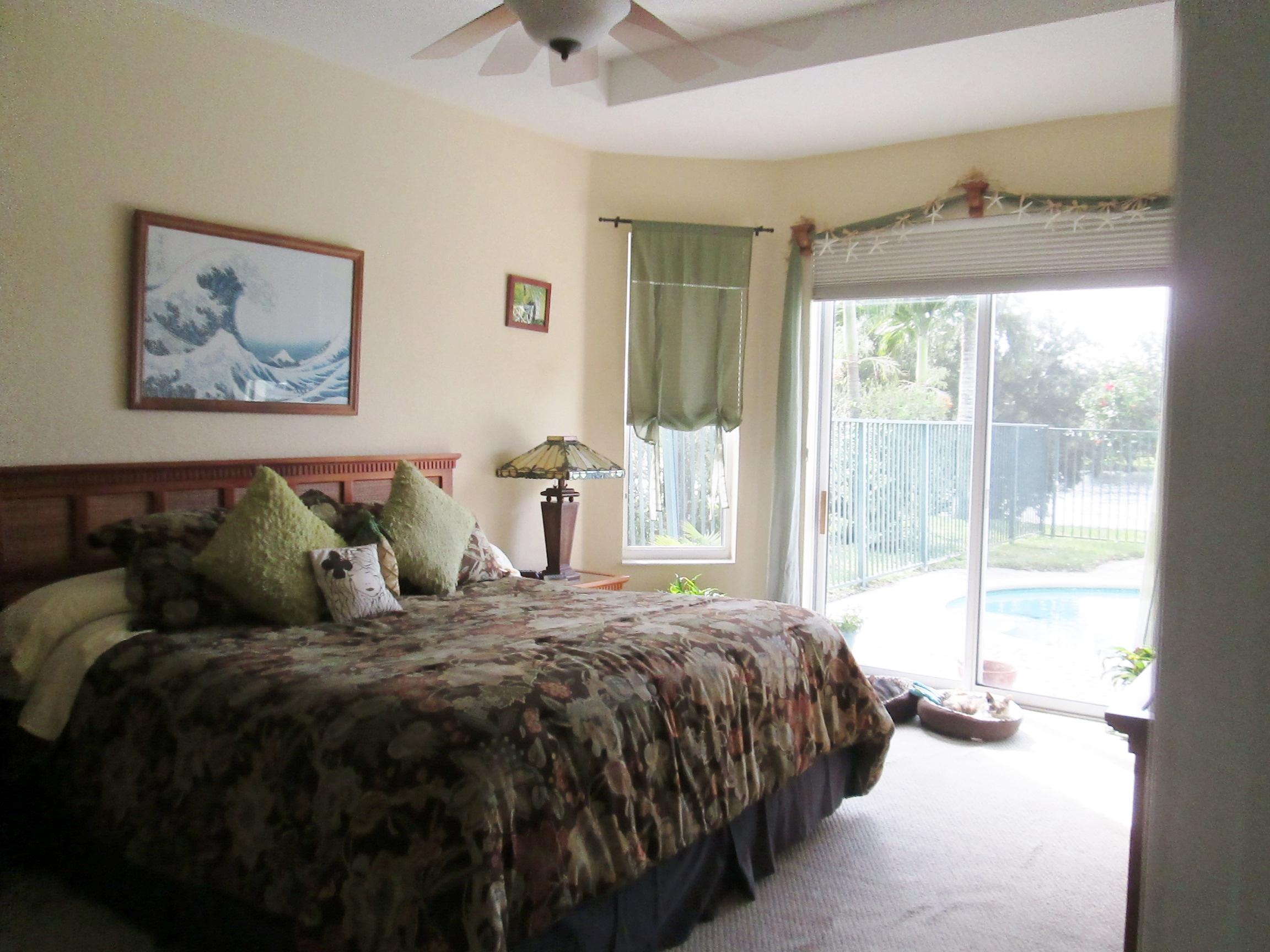 2104 Northwest Marsh Rabbit Lane Jensen Beach, FL 34957 - Photo 17 of 25 Master bedroom