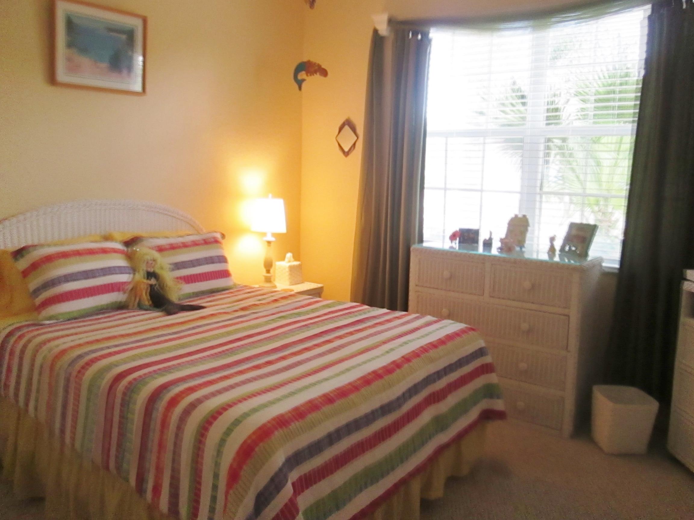 2104 Northwest Marsh Rabbit Lane Jensen Beach, FL 34957 - Photo 22 of 25 Guest bedroom