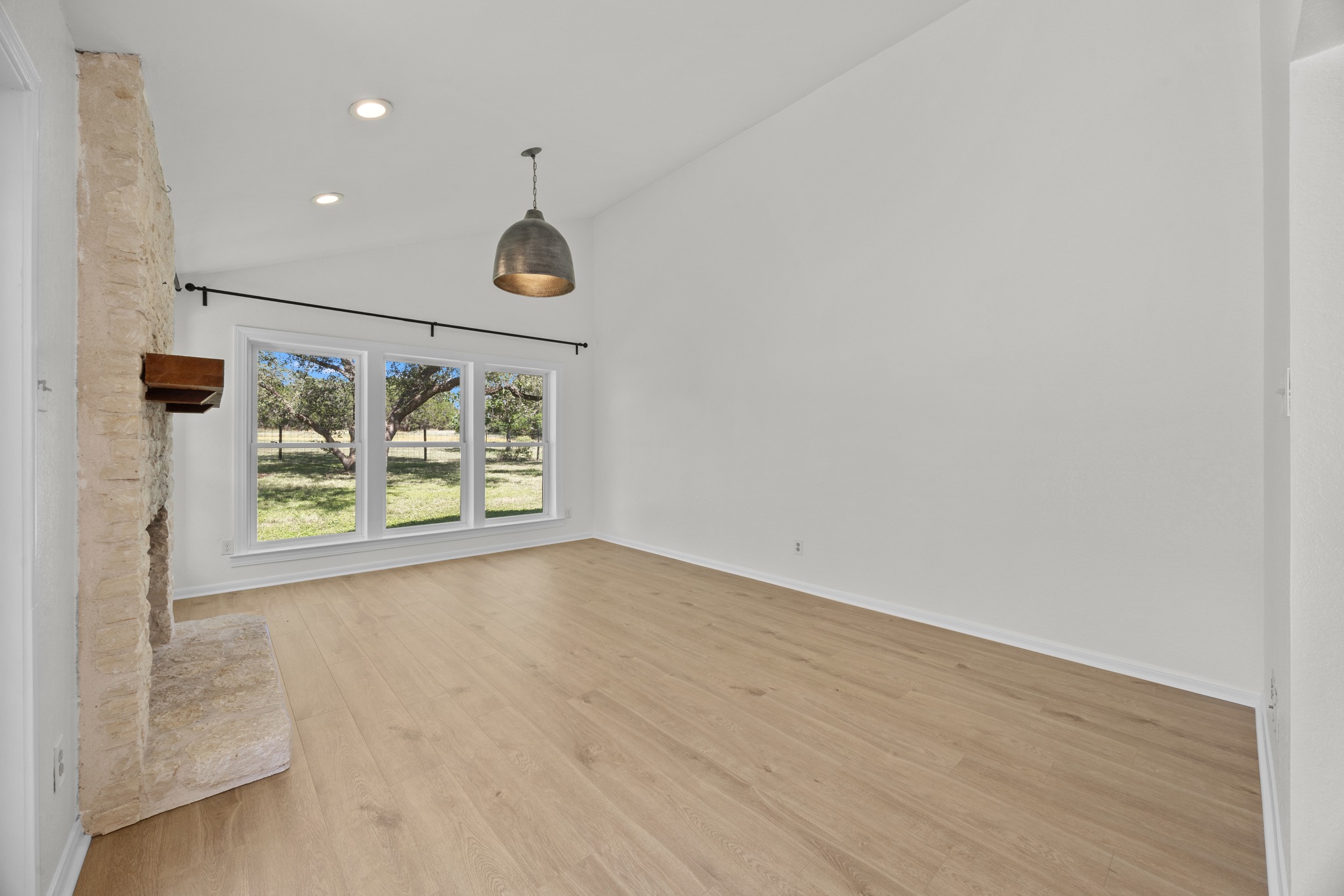 11019 Southwest Oaks Austin, TX 78737 - Photo 15 of 39 Expansive windows showcase views of your peaceful retreat.