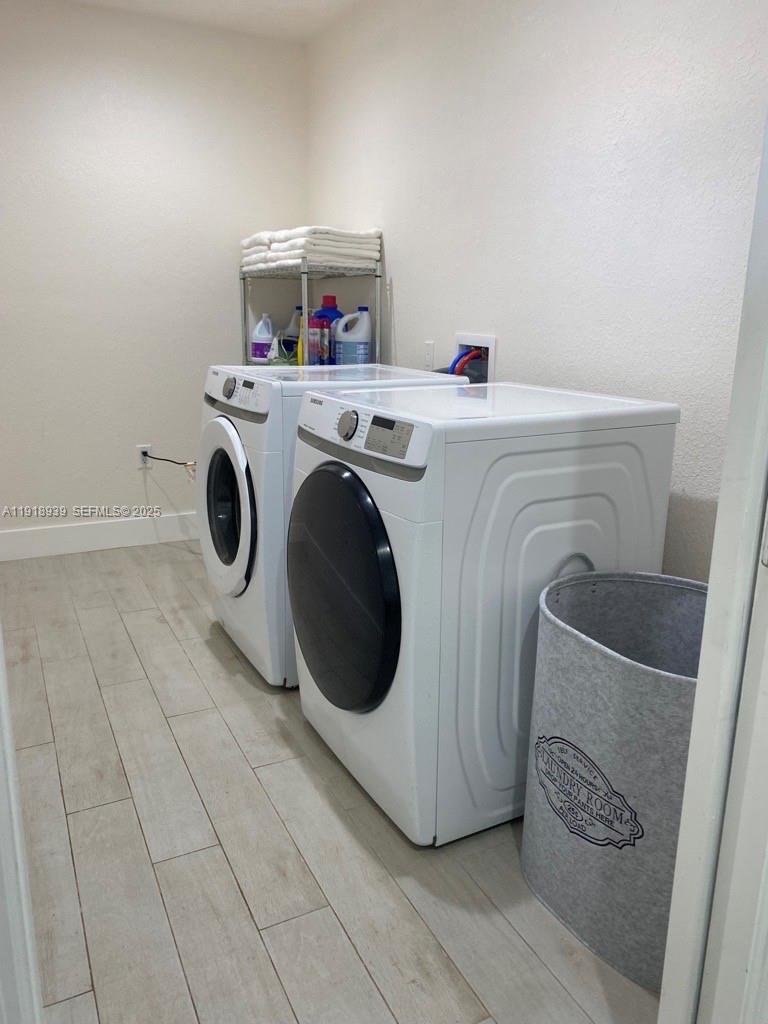 417 Cherry Tree Drive Sebring, FL 33876 - Photo 14 of 26 a utility room with dryer and washer