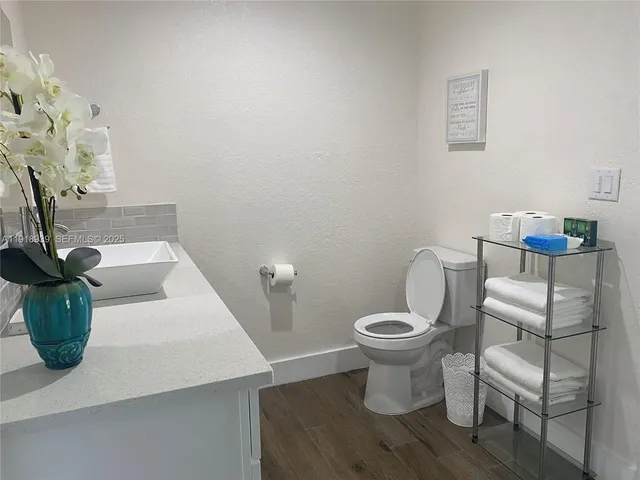a bathroom with a toilet and a sink