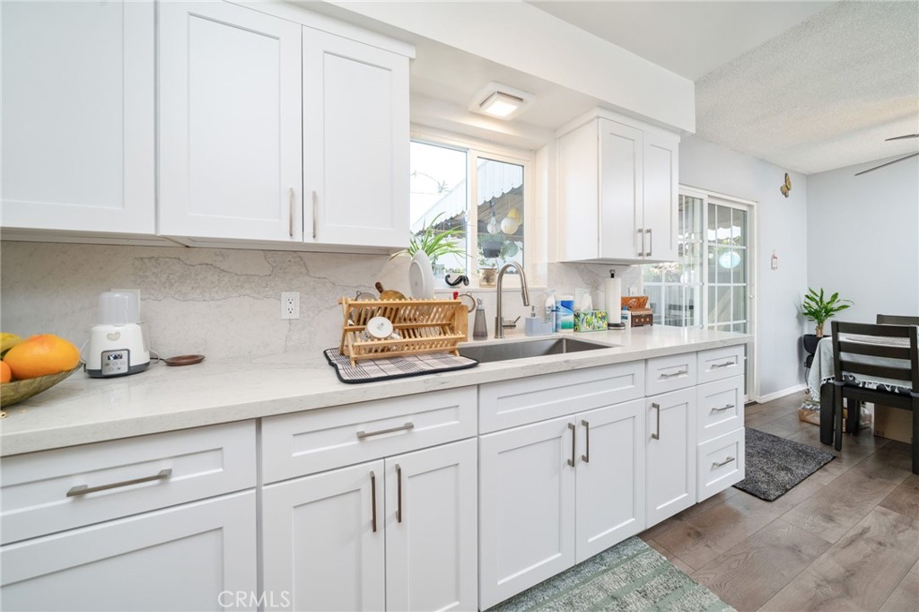 1800 West Gramercy Avenue, Unit 43 Anaheim, CA 92801 - Photo 14 of 34 a kitchen with white cabinets and sink