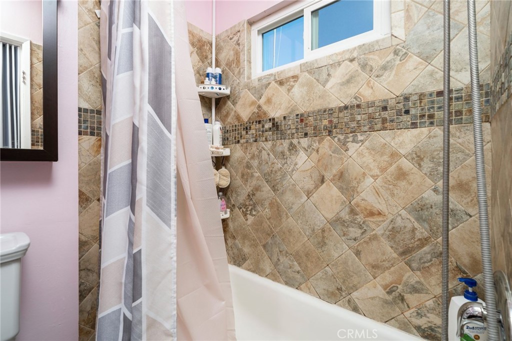 1800 West Gramercy Avenue, Unit 43 Anaheim, CA 92801 - Photo 21 of 34 a bathroom with a shower and a toilet