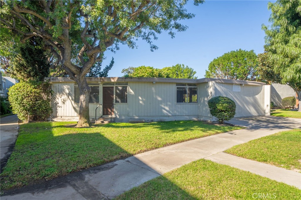 1800 West Gramercy Avenue, Unit 43 Anaheim, CA 92801 - Photo 32 of 34 a view of a backyard with swimming pool
