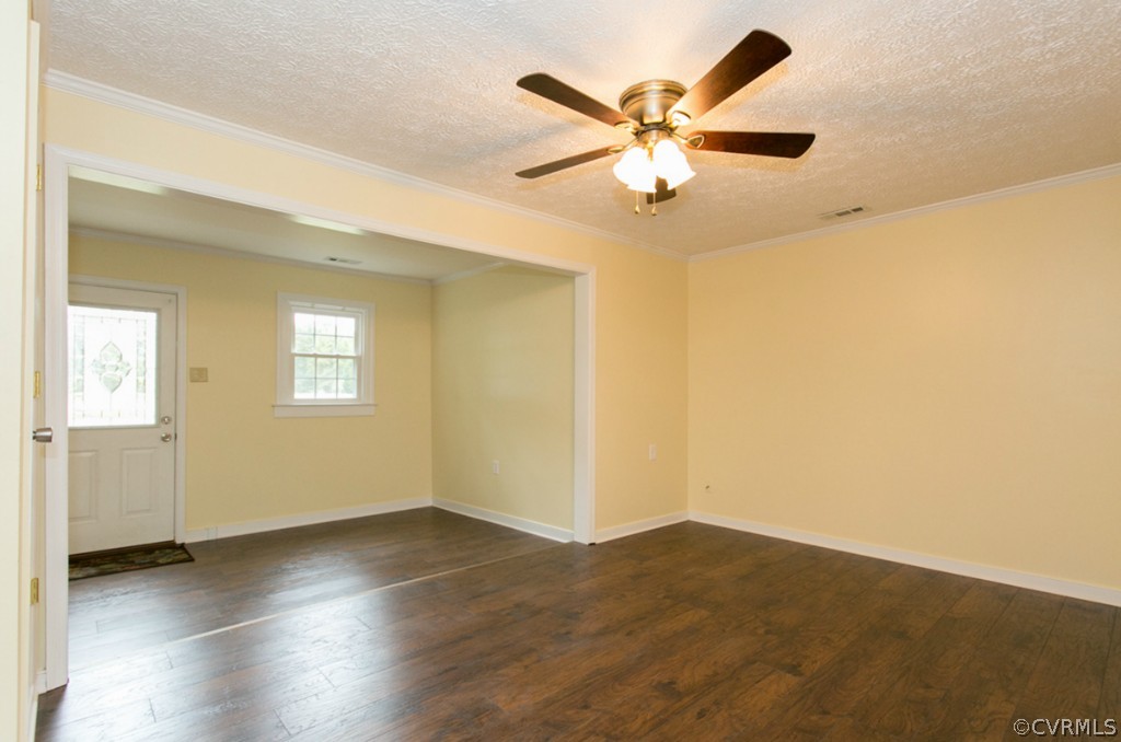12400 Beach Road Chesterfield, VA 23832 - Photo 7 of 23 an empty room with wooden floor fan and windows