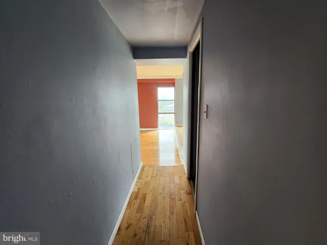 a kitchen with granite countertop stainless steel appliances and wooden cabinets