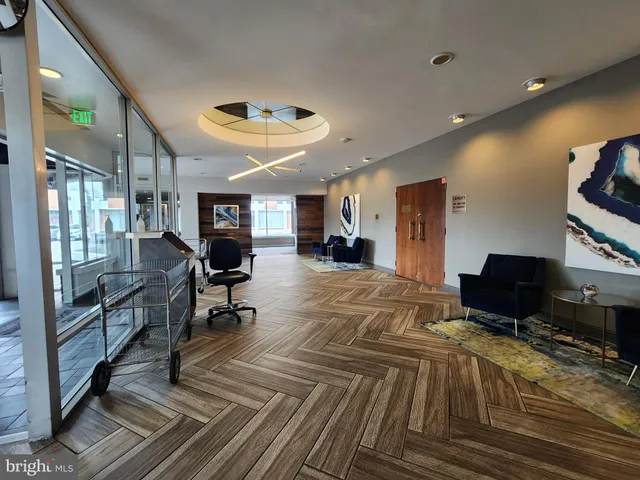 a view of a livingroom with furniture and a flat screen tv