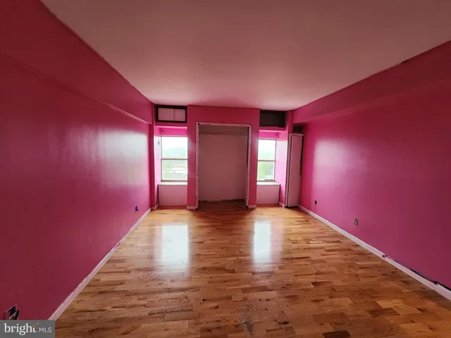 a living room with furniture and gym equipment