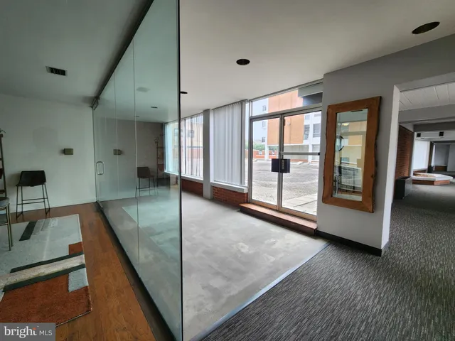 a view of an entryway with kitchen