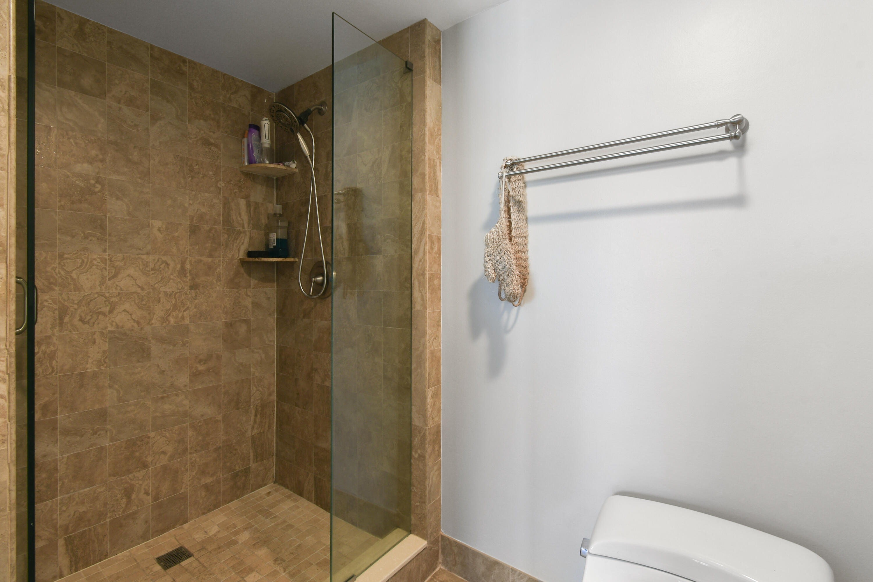 2401 Marina Isle Way, Unit 503 Jupiter, FL 33477 - Photo 23 of 46 a bathroom with a shower and toilet