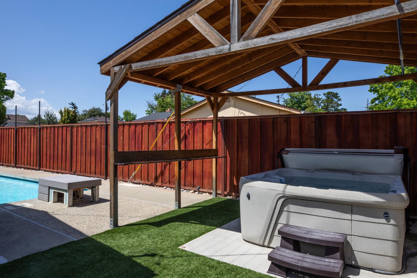 1937 Adelaide Way San Jose, CA 95124 - Photo 25 of 33 a view of a backyard with a tub and wooden fence