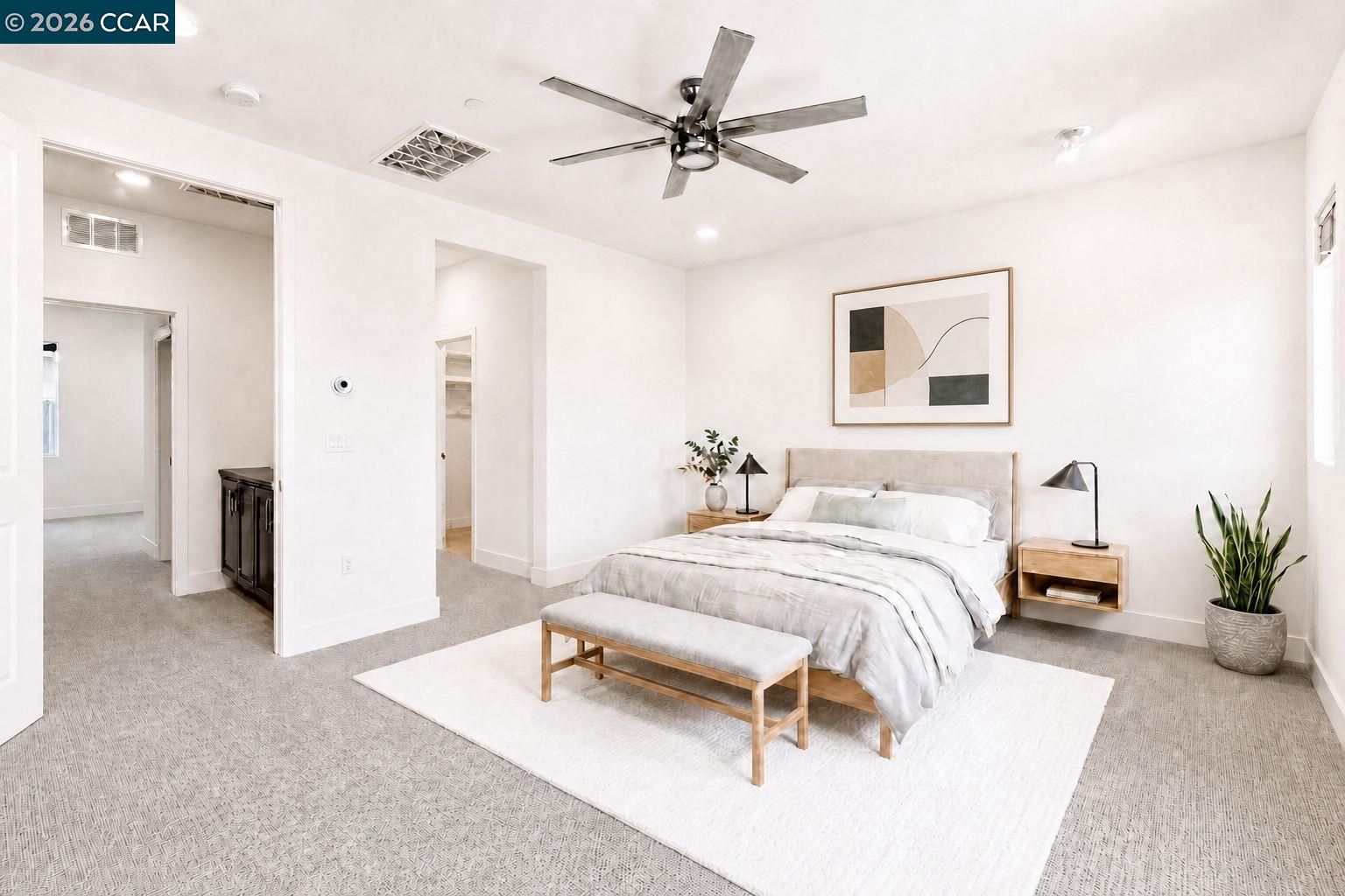 205 Plum Tree Street Livermore, CA 94551 - Photo 5 of 47 a spacious bedroom with a bed and a chandelier