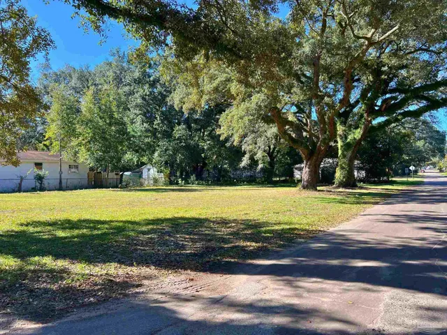 a view of a swimming pool and a yard