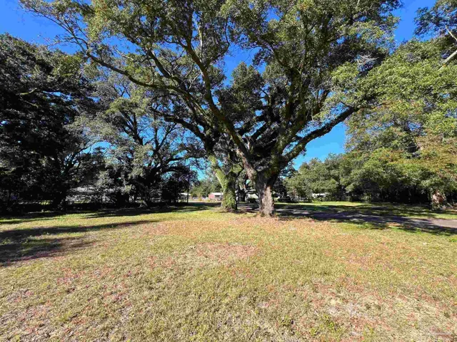 a aerial view of residential houses with outdoor space