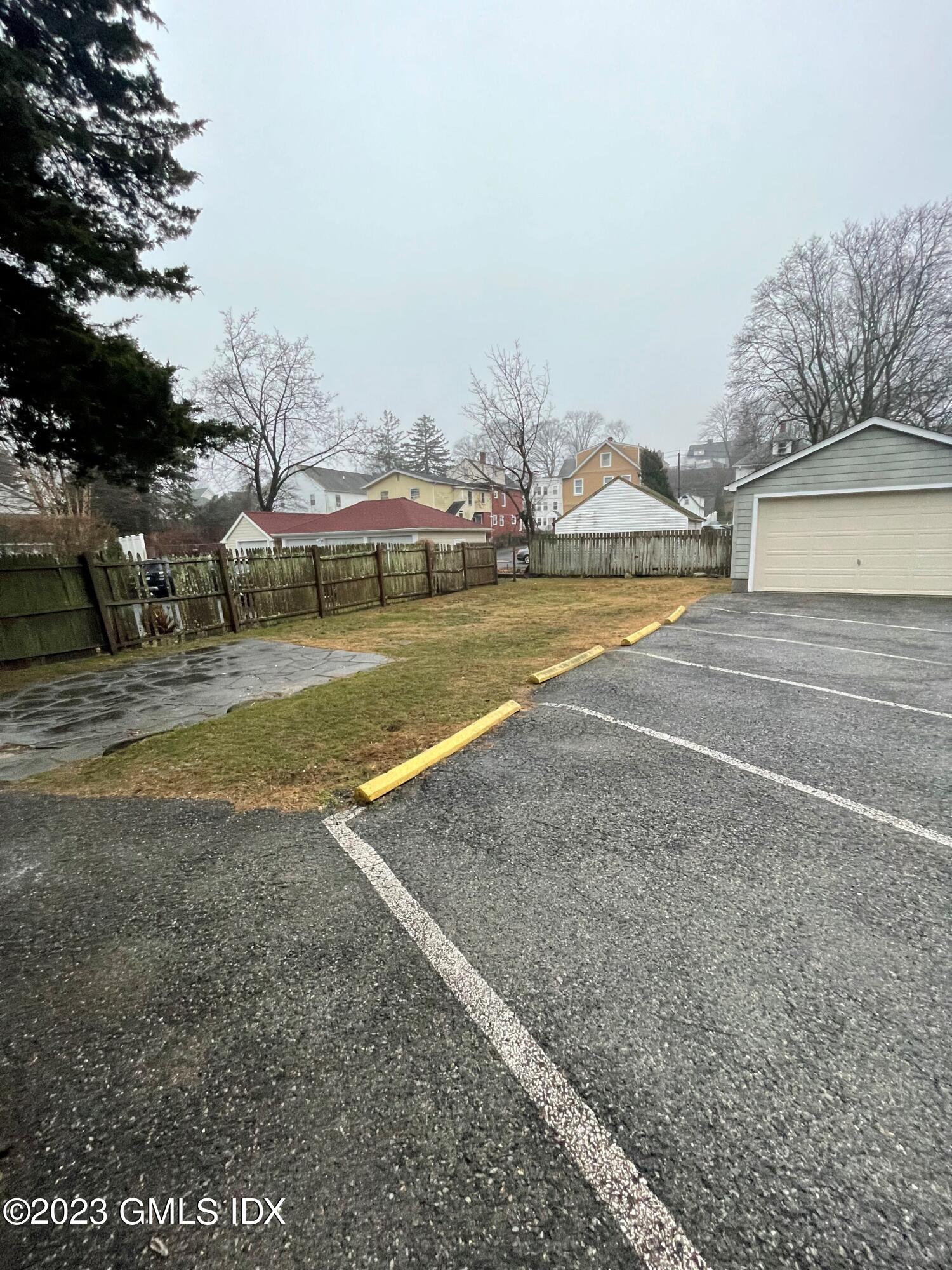72 Prospect Street Greenwich, CT 06830 - Photo 18 of 18 a view of a house with swimming pool and yard