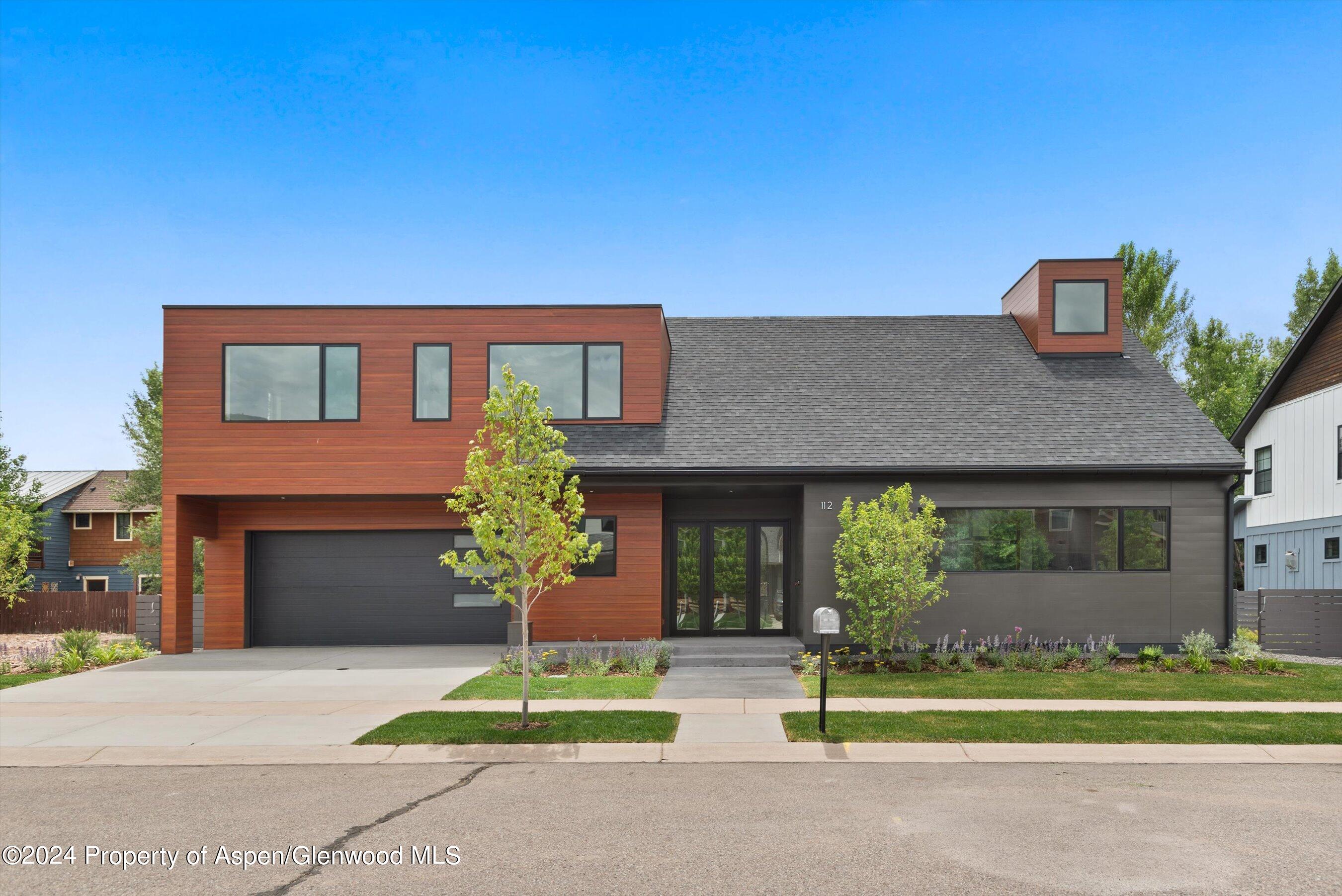112 Valley Court Basalt, CO 81621 - Photo 2 of 37 a house that has a tree in front of it