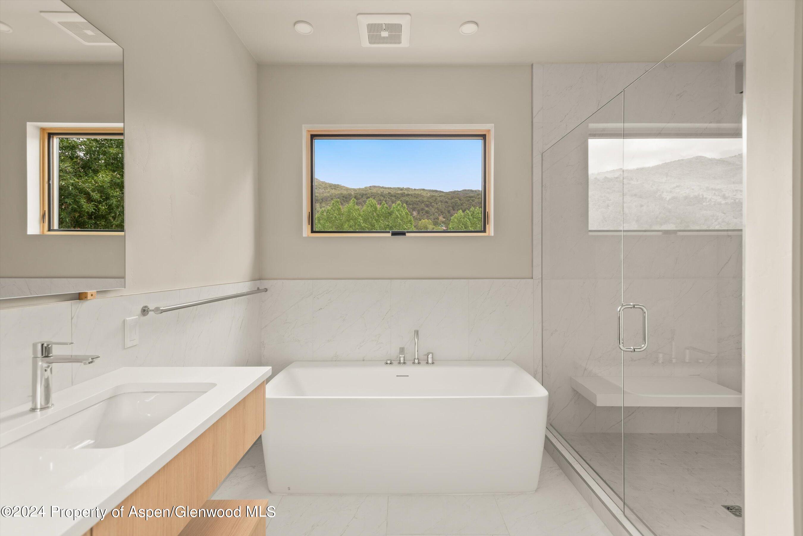 112 Valley Court Basalt, CO 81621 - Photo 27 of 37 a white bath tub sitting next to a white sink