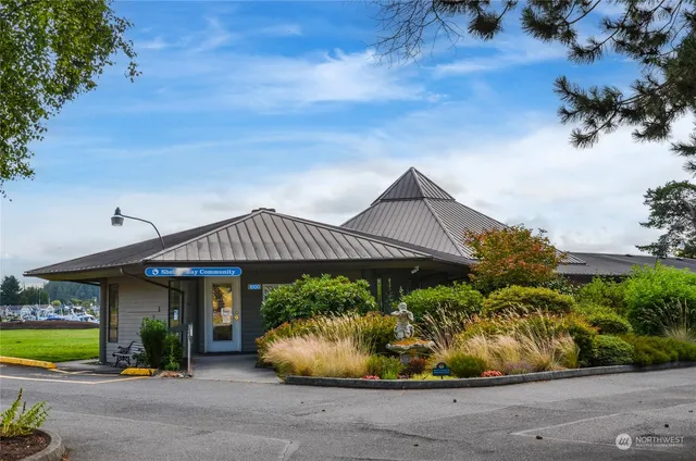 a view of a swimming pool with an outdoor seating