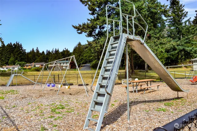 a view of a swimming pool with a lounge chairs