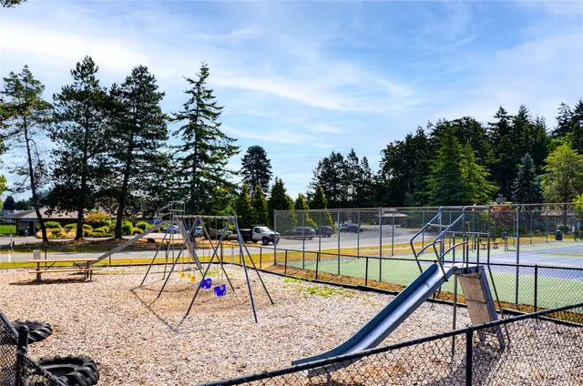 a view of a swimming pool with a lawn chairs