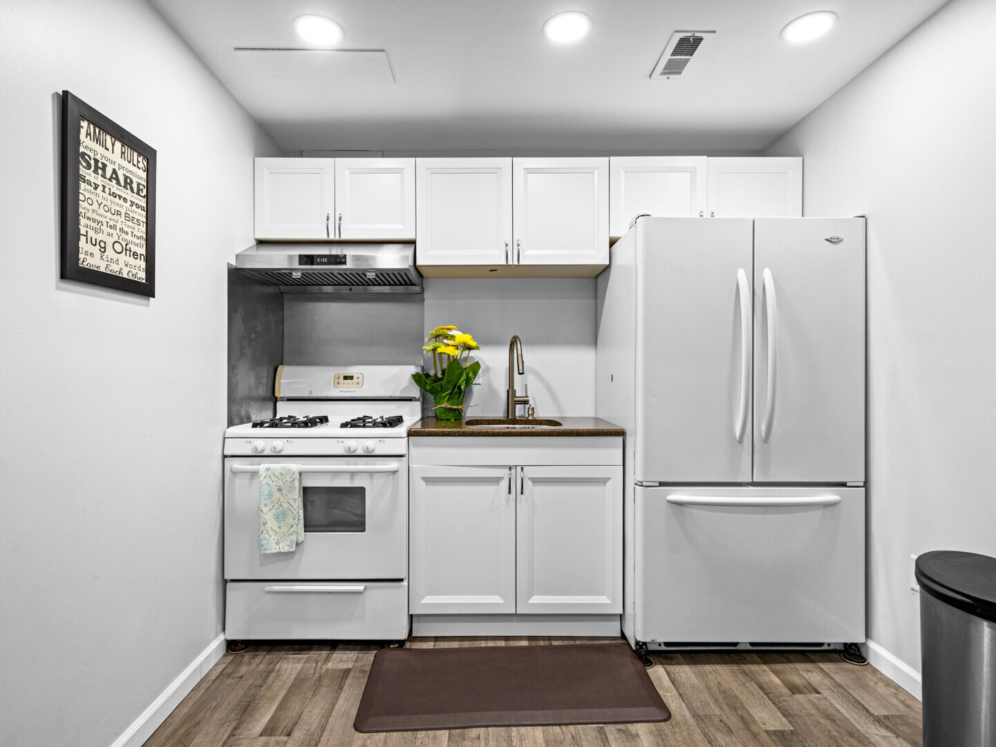 506 Oneida Street Joliet, IL 60435 - Photo 24 of 40 a kitchen with a refrigerator and a stove top oven