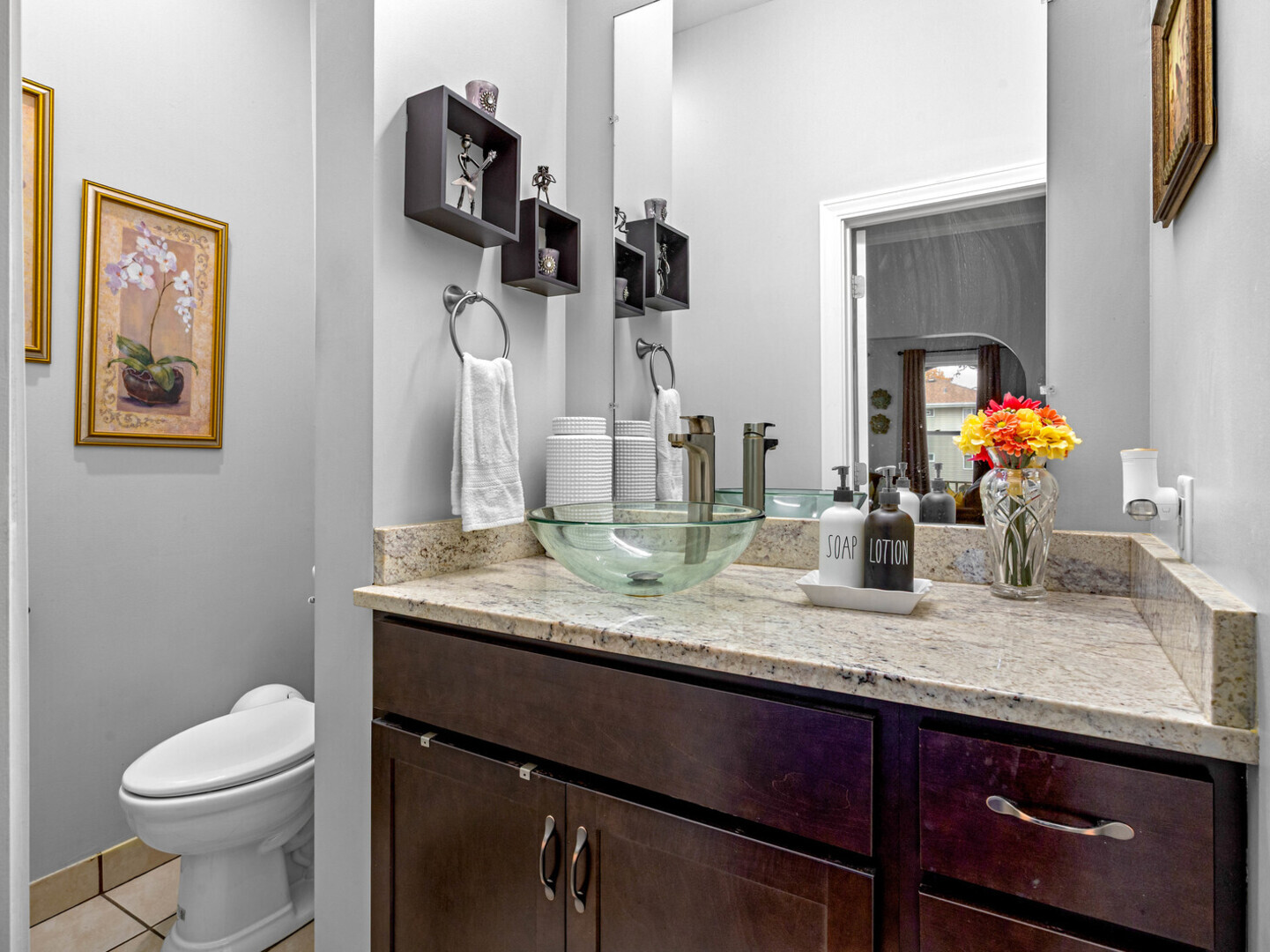 506 Oneida Street Joliet, IL 60435 - Photo 32 of 40 a bathroom with a granite countertop sink a toilet and mirror