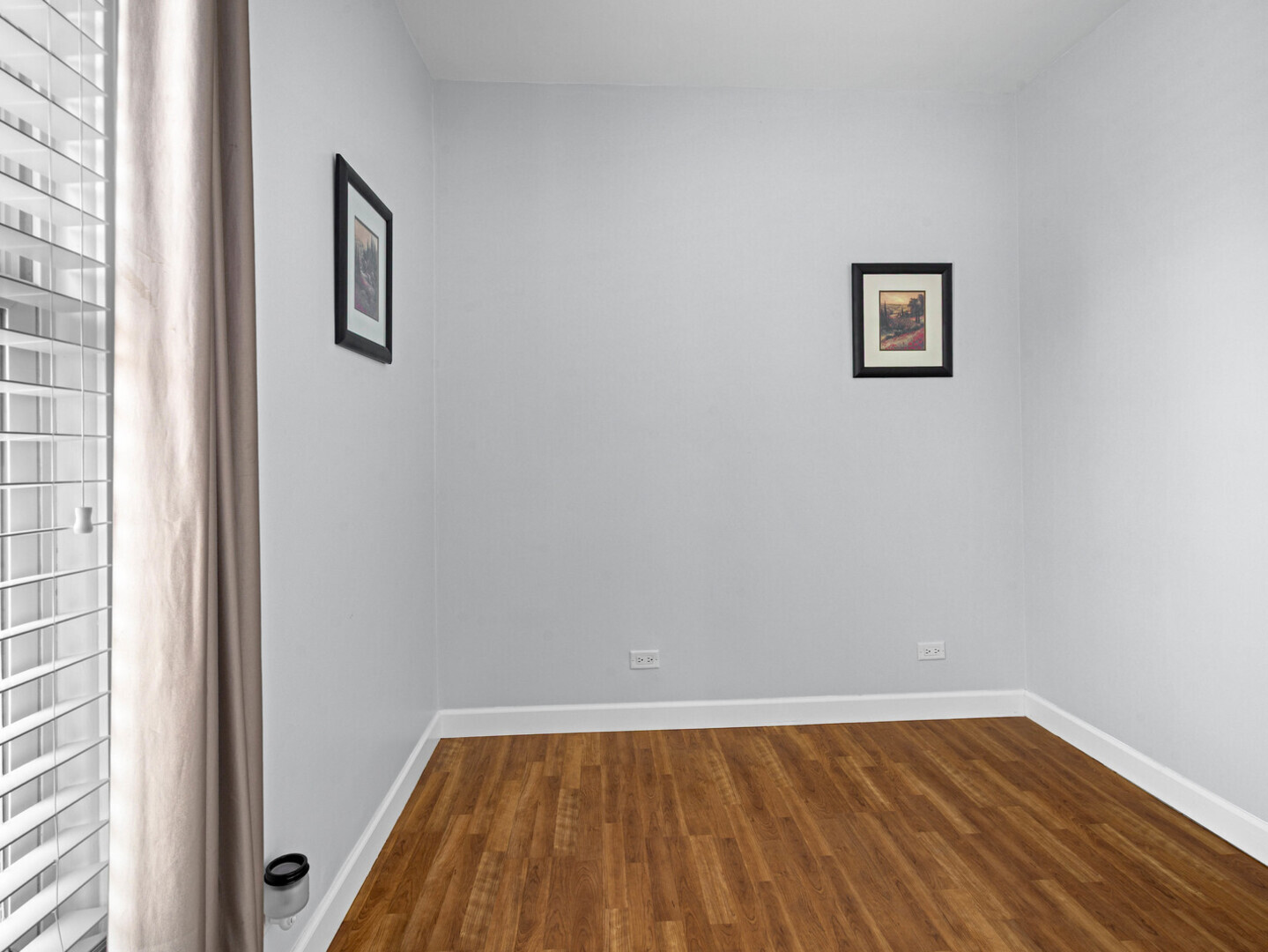 506 Oneida Street Joliet, IL 60435 - Photo 34 of 40 a view of a room with wooden floor and window