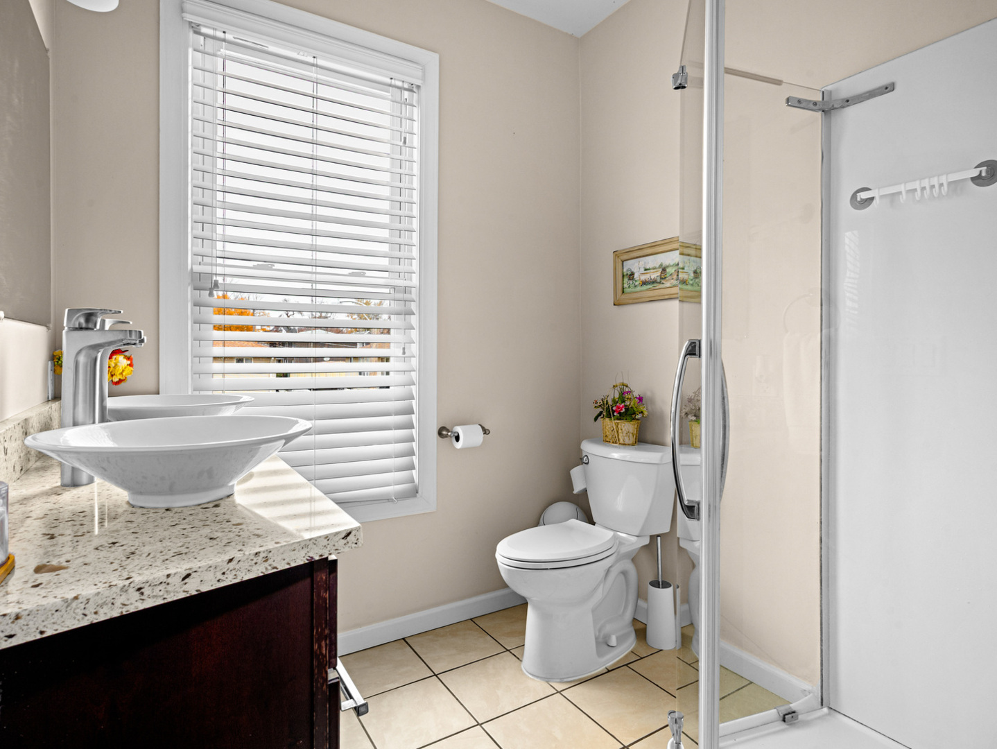 506 Oneida Street Joliet, IL 60435 - Photo 38 of 40 a bathroom with a granite countertop sink and a toilet