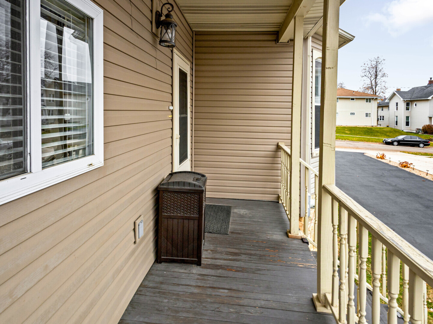 506 Oneida Street Joliet, IL 60435 - Photo 8 of 40 a view of a balcony with wooden floor and fence