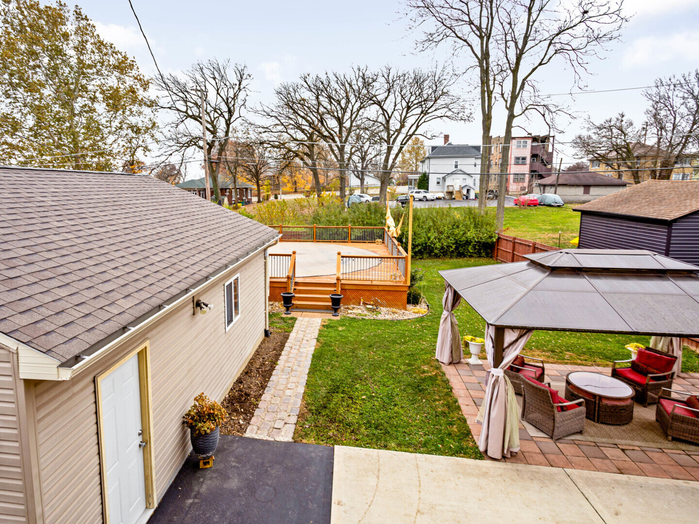 506 Oneida Street Joliet, IL 60435 - Photo 9 of 40 a view of a patio with table and chairs and potted plants