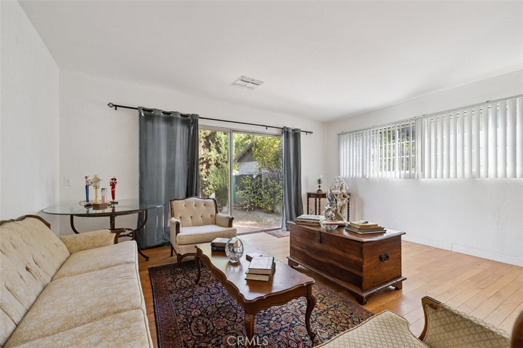 23265 Leonora Drive Woodland Hills, CA 91367 - Photo 3 of 3 a living room with furniture and a window