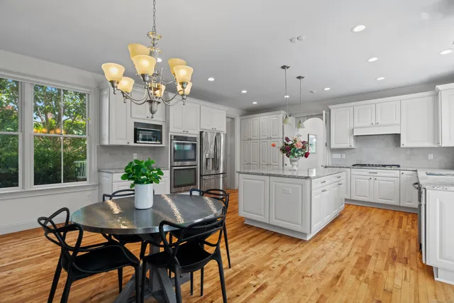 a kitchen with a table and chairs in it