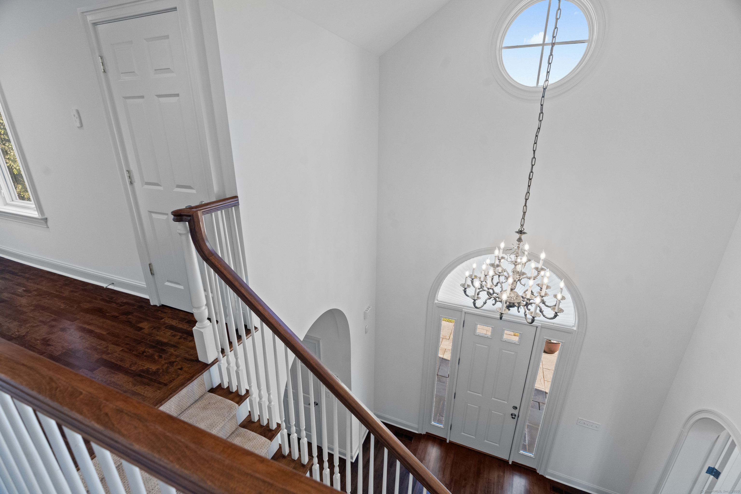 64 Webster Point Road Madison, CT 06443 - Photo 22 of 38 a view of entryway and hall with wooden floor