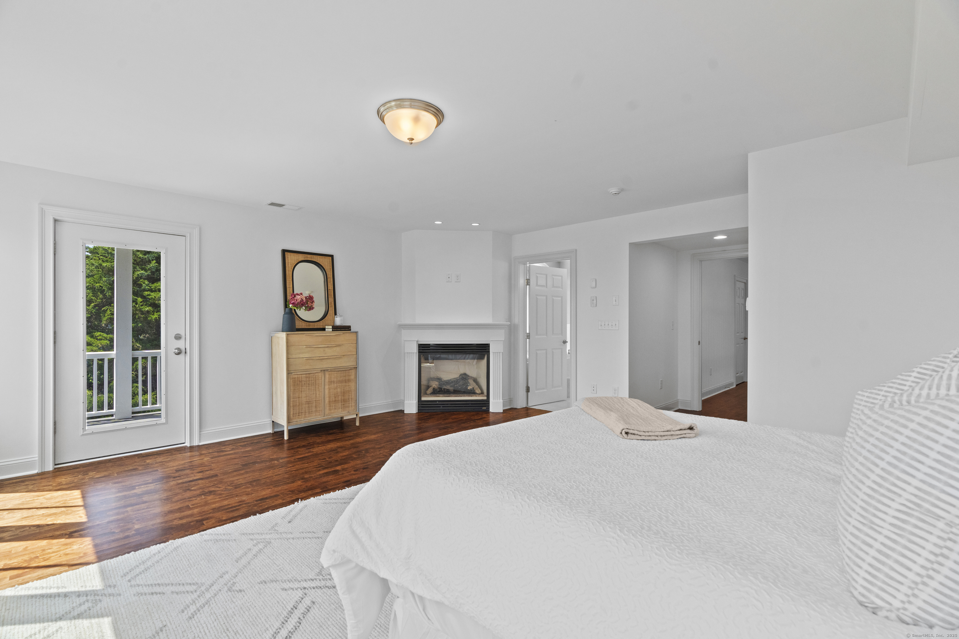 64 Webster Point Road Madison, CT 06443 - Photo 24 of 38 a bedroom with a bed and a window