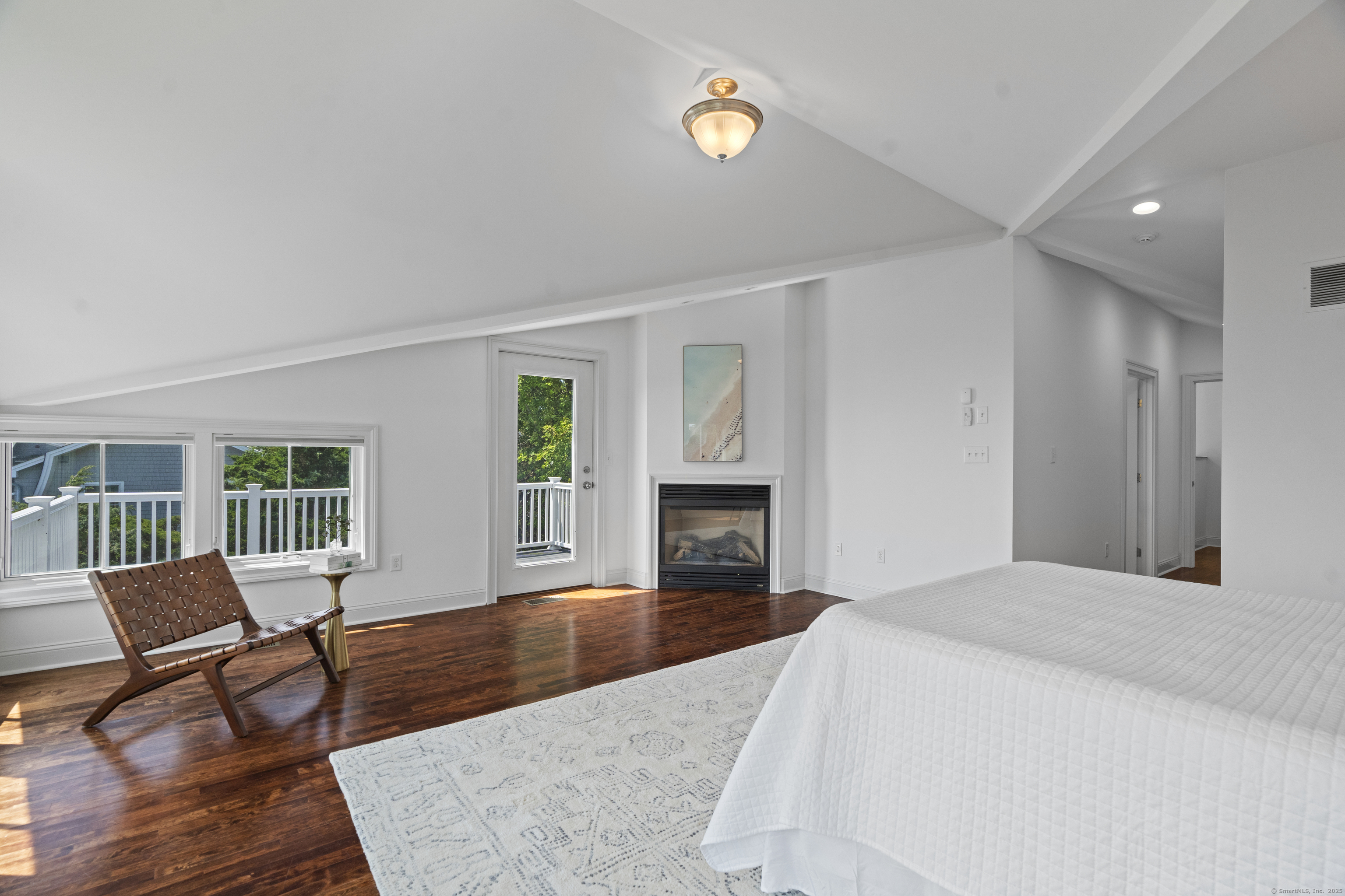 64 Webster Point Road Madison, CT 06443 - Photo 33 of 38 a living room with furniture and a fireplace
