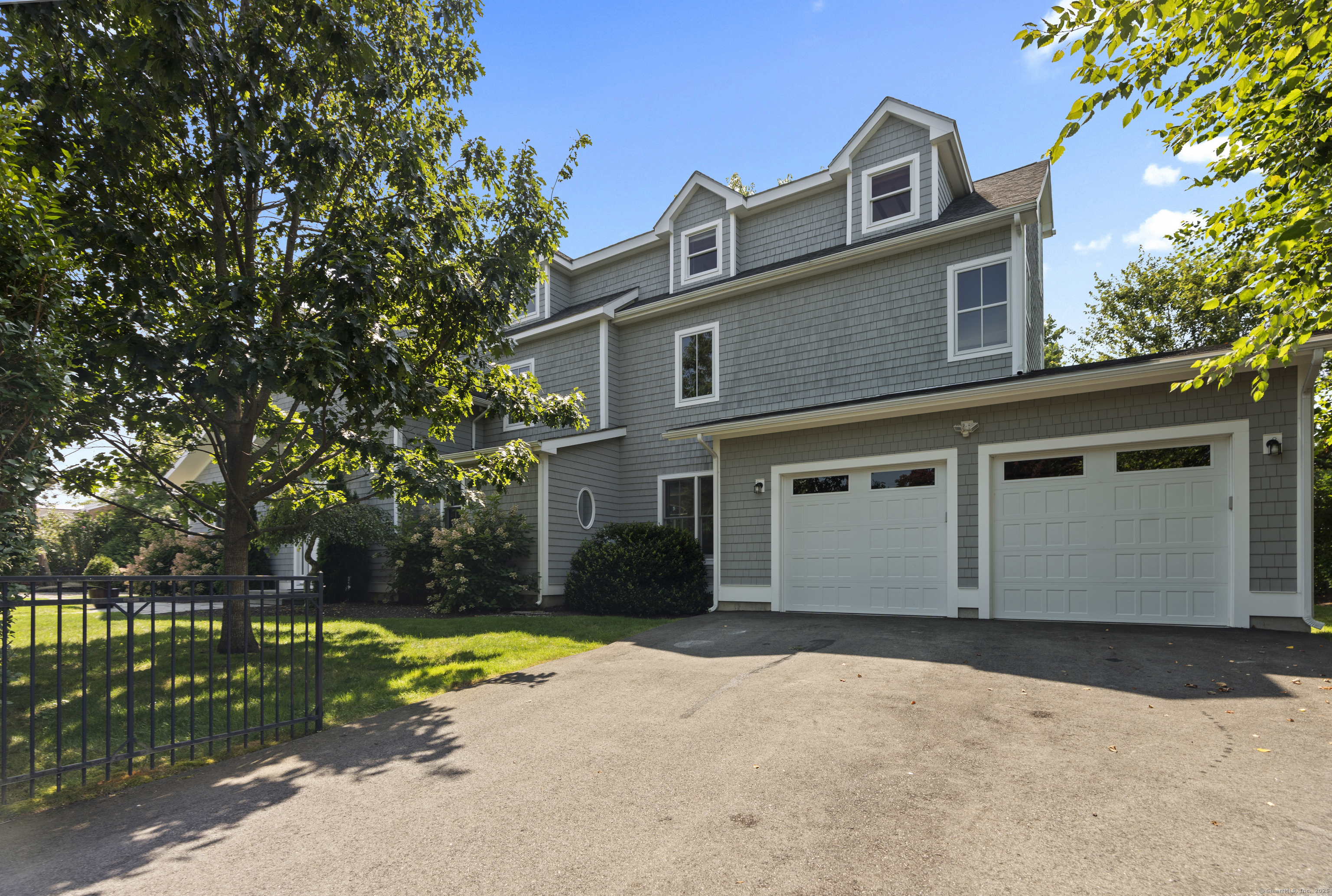 64 Webster Point Road Madison, CT 06443 - Photo 6 of 38 a view of a house with a yard and plants