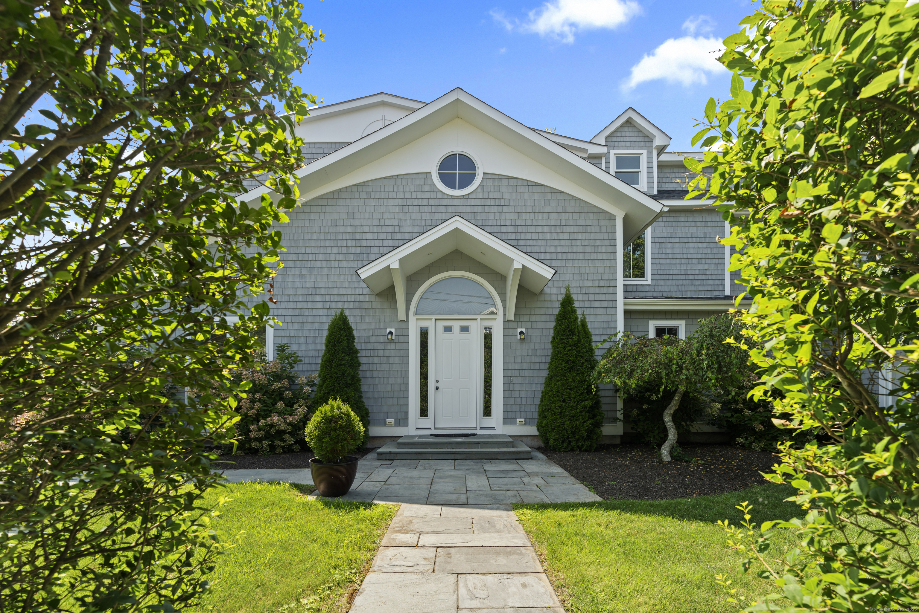 64 Webster Point Road Madison, CT 06443 - Photo 7 of 38 a front view of a house with yard