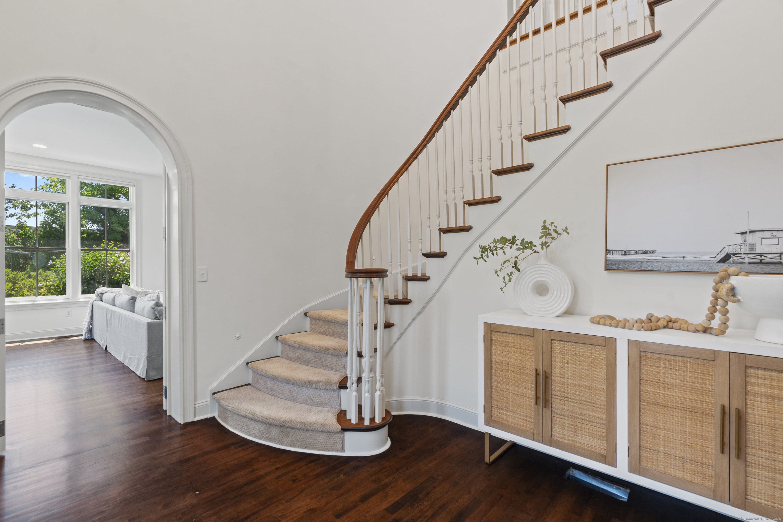 64 Webster Point Road Madison, CT 06443 - Photo 9 of 38 a view of entryway with wooden floor and stairs