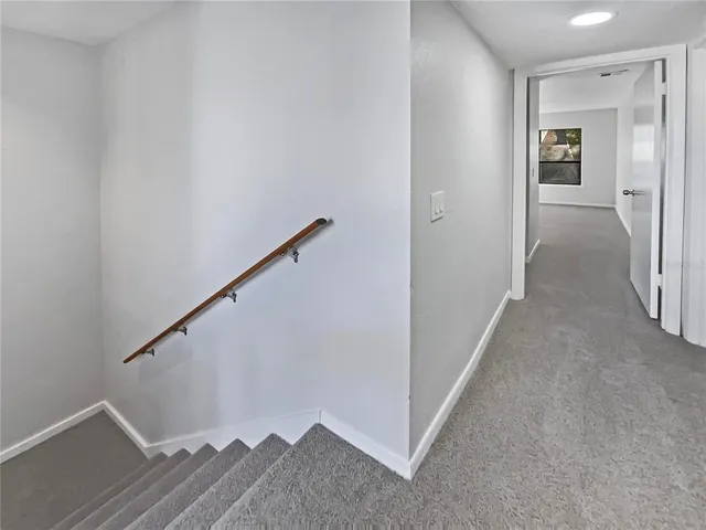 a view of a hallway with staircase