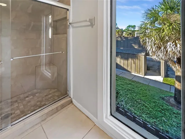 a bathroom with a glass shower door