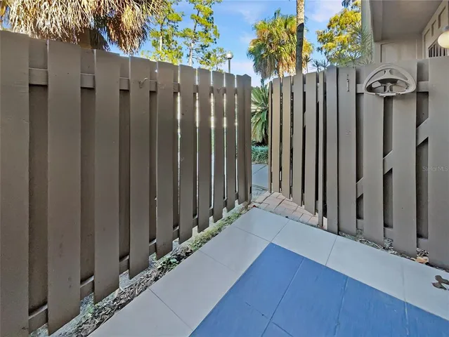 a view of a wooden door with a wooden fence