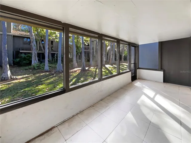 a view of a room with a large window
