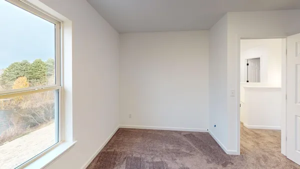 a view of an empty room and window