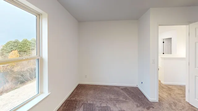 a view of an empty room and window