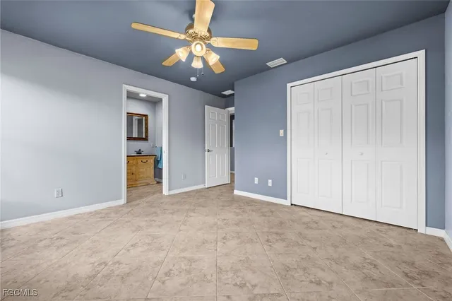 a utility room with cabinets washer and dryer