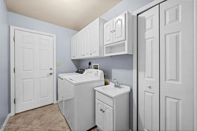 a view of a patio with a table chairs and garden