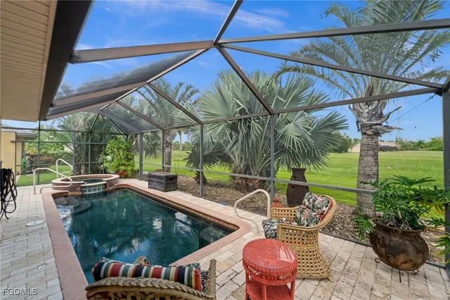 a backyard of a house with outdoor seating