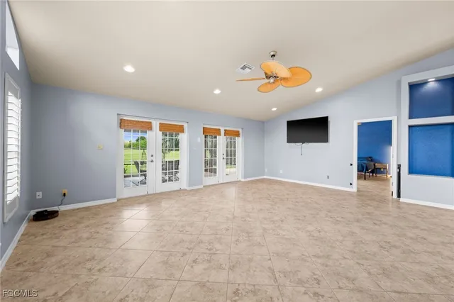 a view of kitchen with furniture and refrigerator