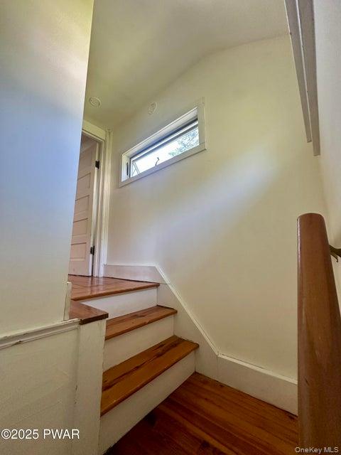 355-359 German Hill Road Shohola, PA 18458 - Photo 13 of 50 Stairway with wood finished floors