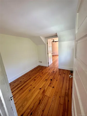 wooden floor in a room with a window